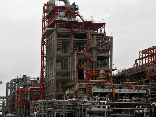 an employee walks inside the premises of an oil refinery of essar oil which runs india s second biggest private sector refinery in vadinar in the western state of gujarat india october 4 2016 picture taken october 4 2016 photo reuters